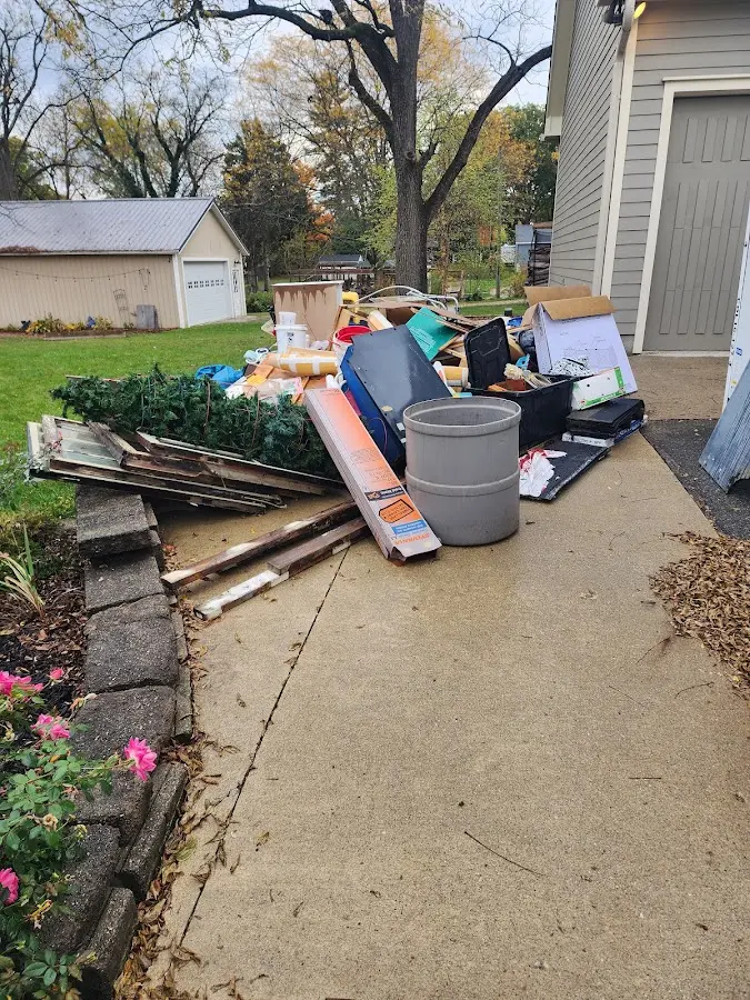 Dumpster being loaded with debris for Estate Cleanout Dumpster Rental in West Columbia